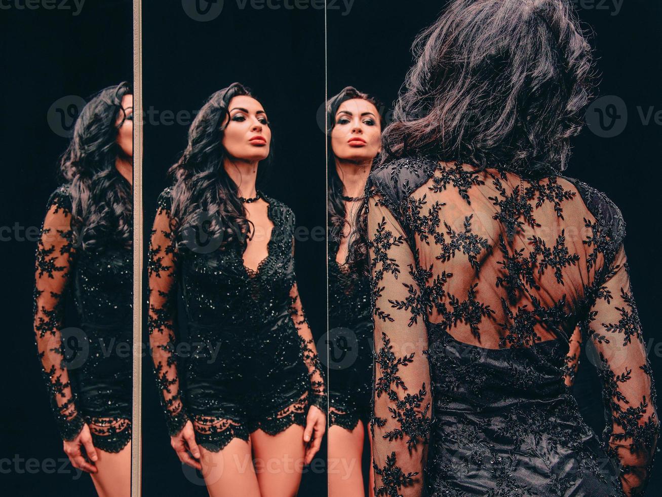 portrait of beautiful, attractive slim brunette woman near the mirrors. Fashion, style concept photo