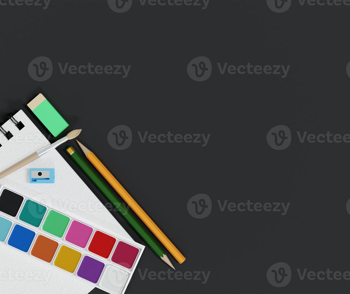 school supplies with watercolor and paintbrush on table background photo