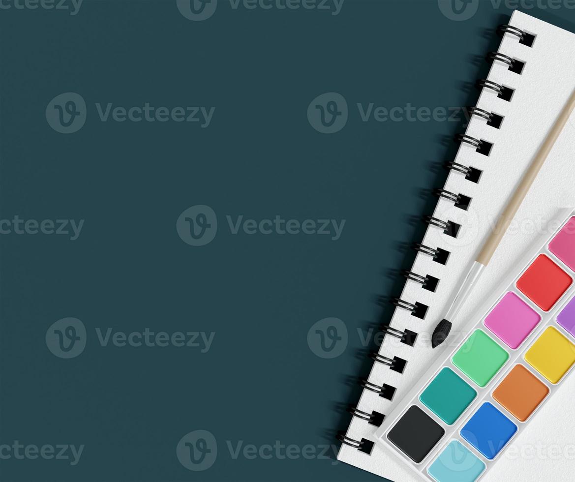 school supplies with watercolor and paintbrush on table background photo