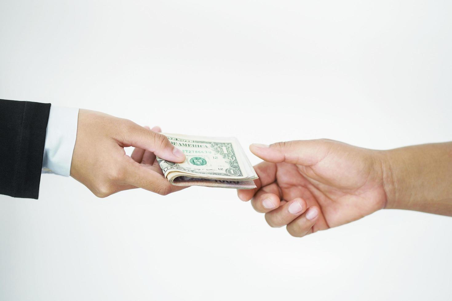 businessman giving money to hand isolate on white background photo