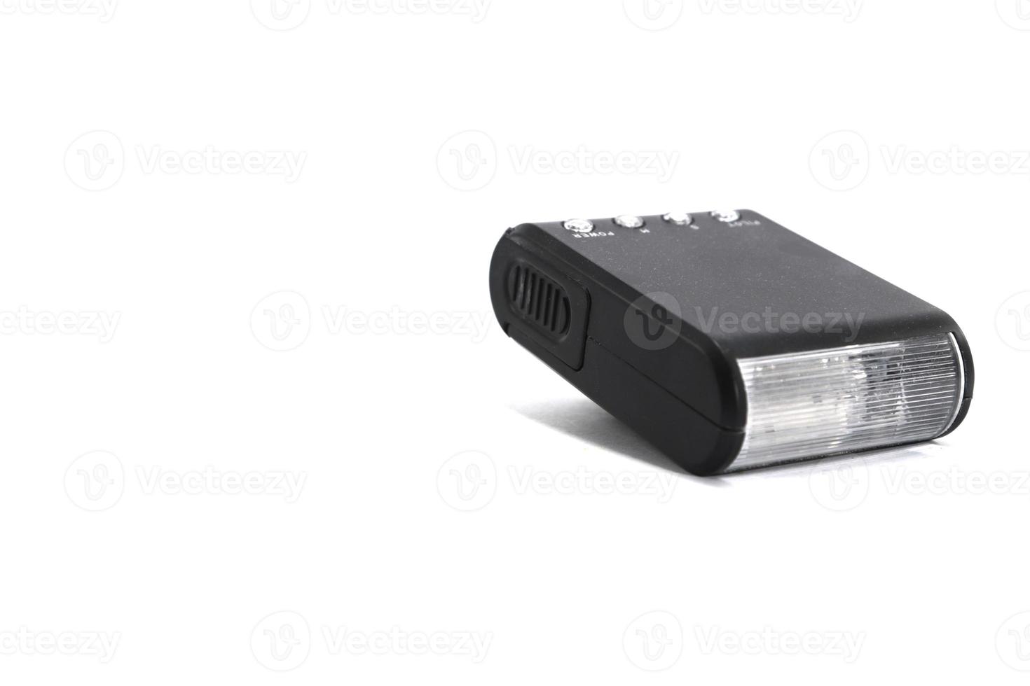 small flash-manual camera on a white background is an accessory for beginner photographers looking for sharpness. photo