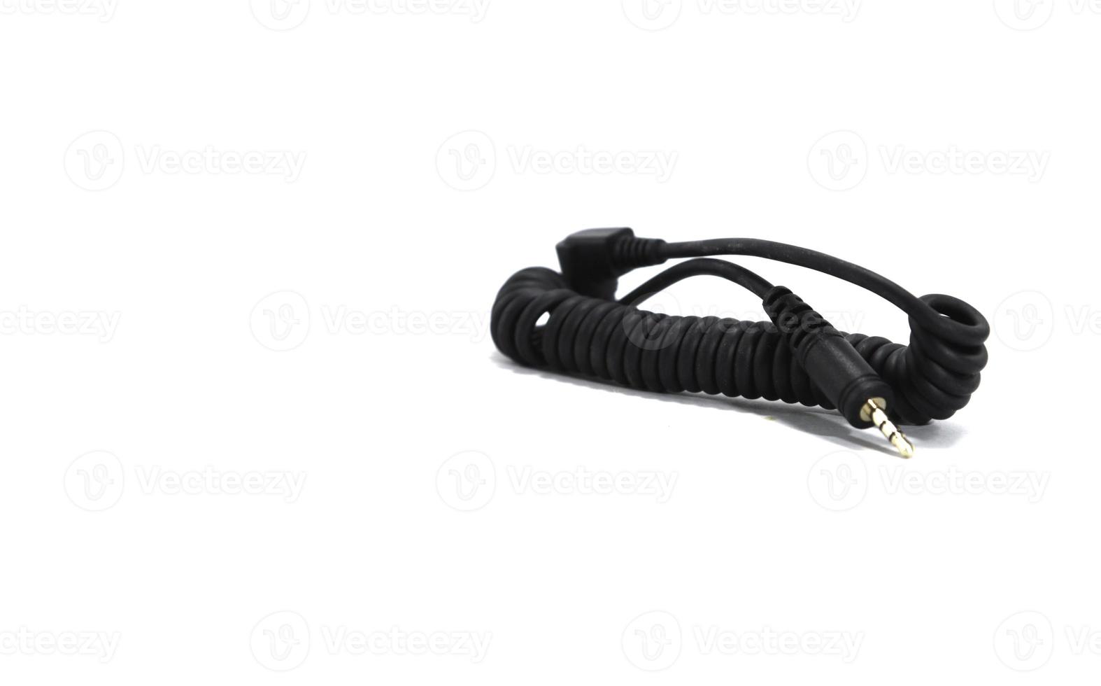 Cable for synchronizing the camera and flash on a white background. photo