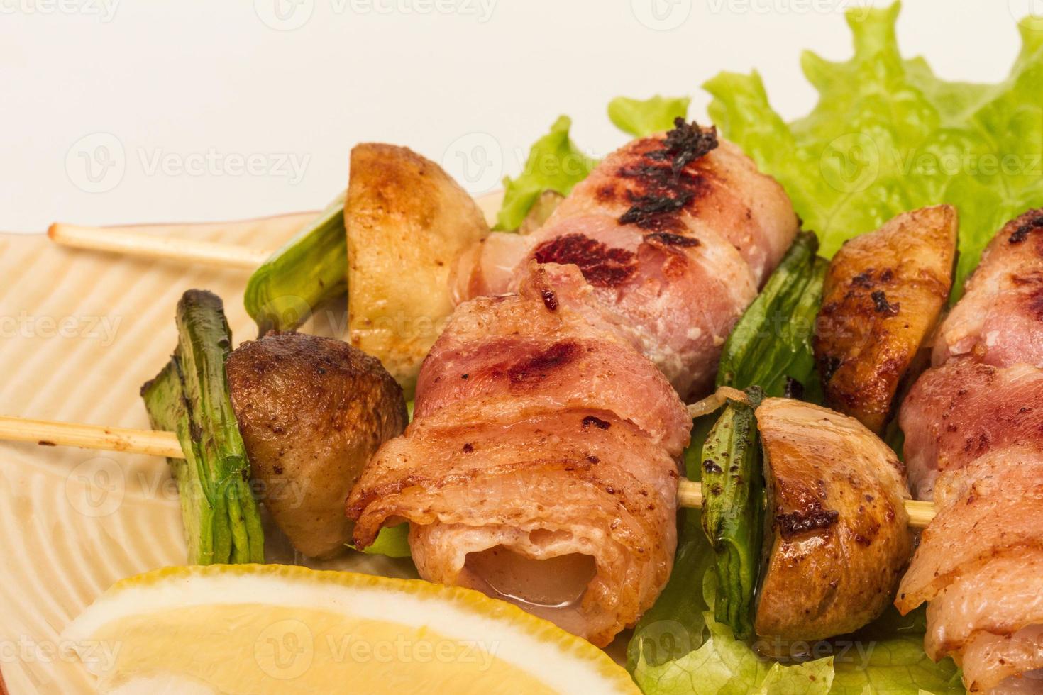 Bacon wrapped grilled Scallops with mushrooms and bacon photo