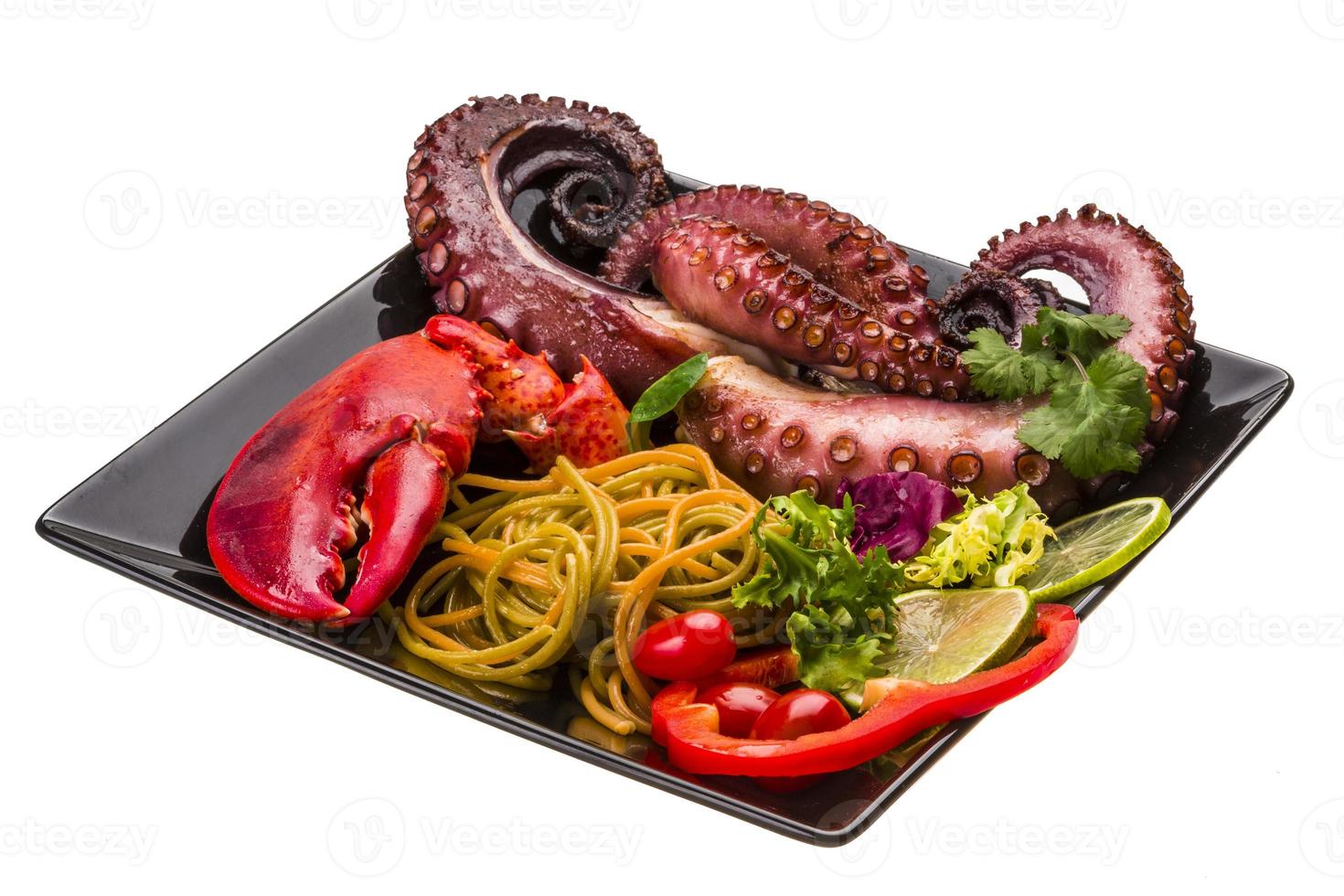 Seafood pasta with octopus and lobster leg photo