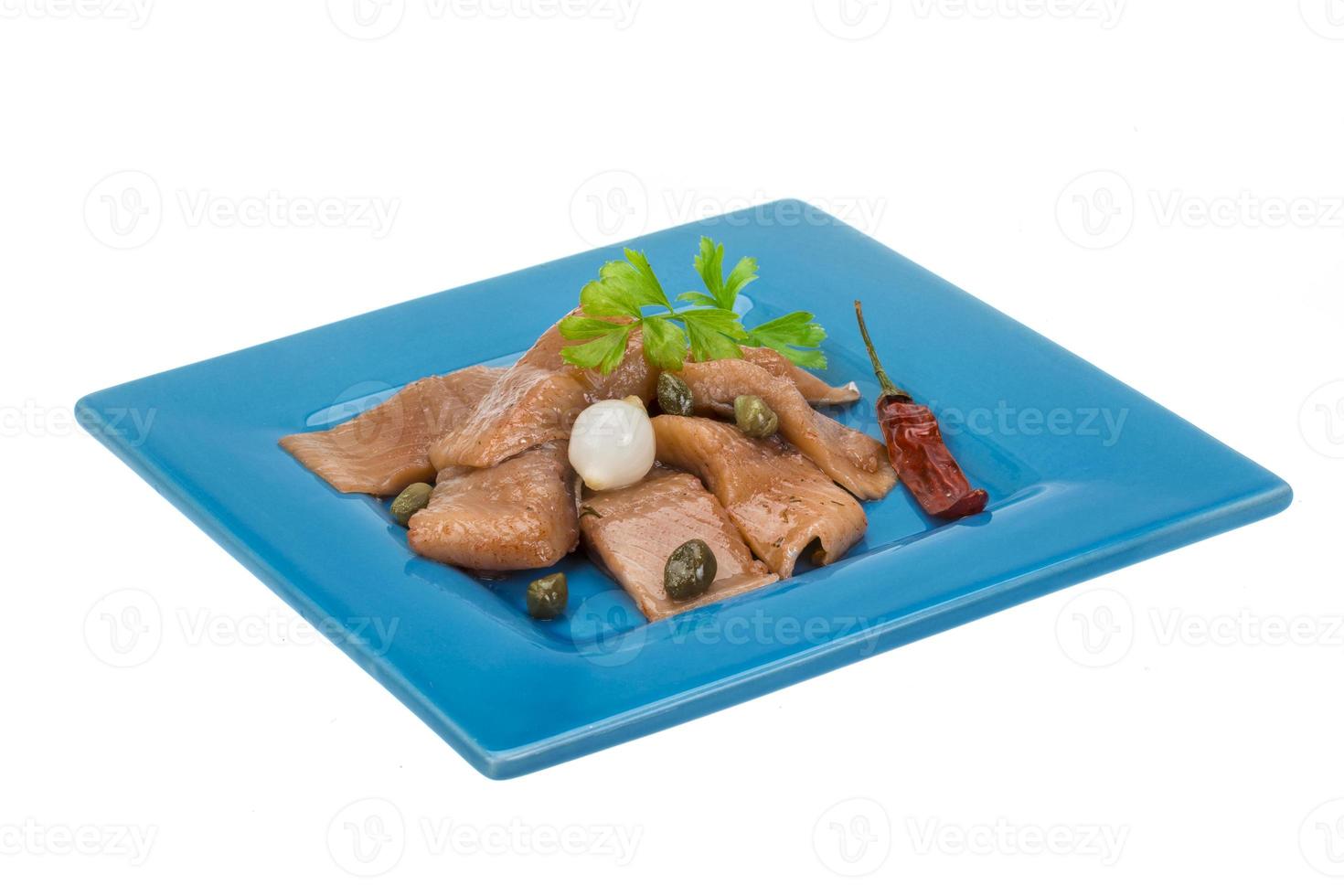 Sliced marinated herring photo