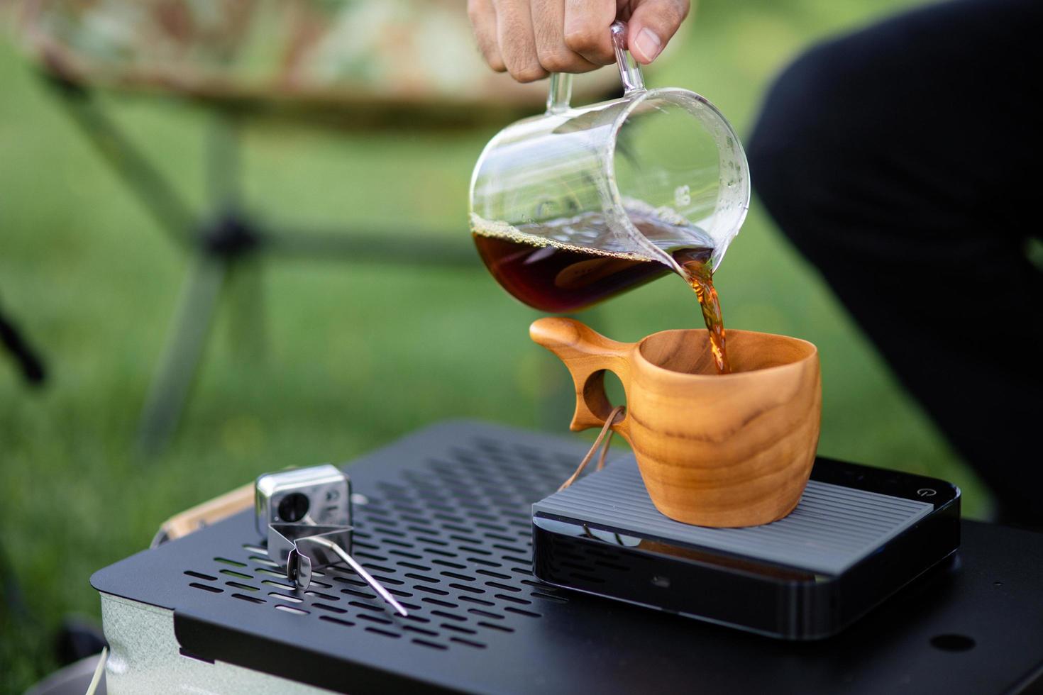 Professional barista preparing coffee maker and drip kettle. Alternative ways of brewing coffee. photo