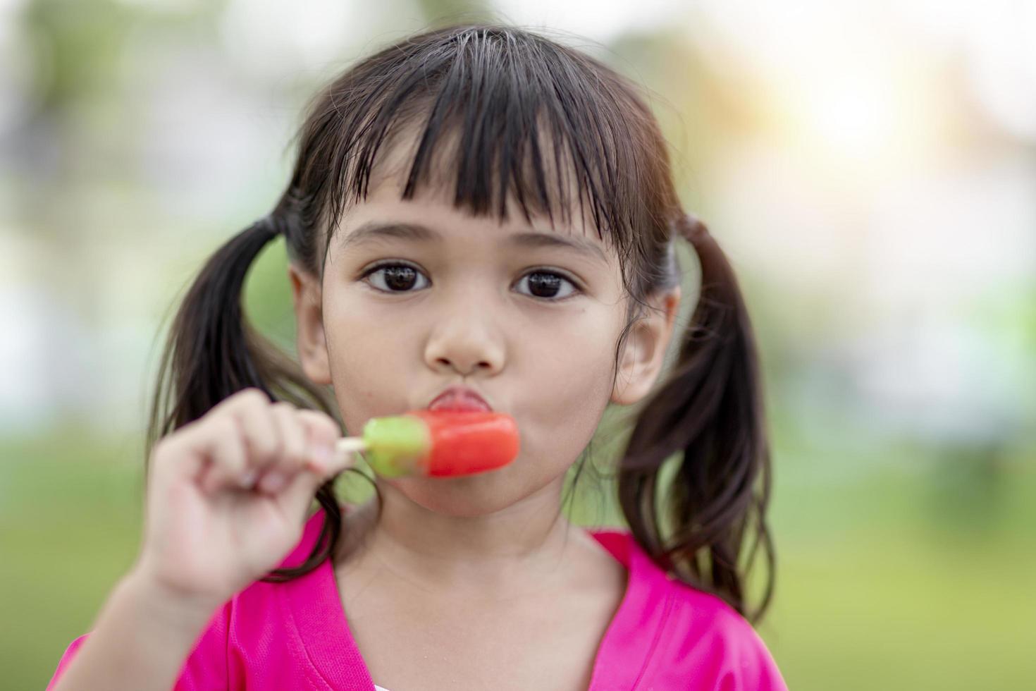 Cute Toddler Girl Eating Ice-Cream photo