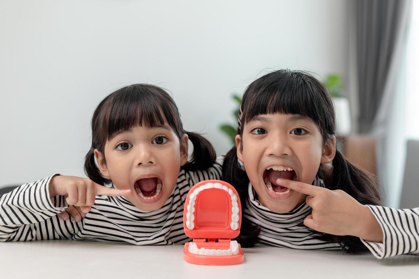 little girl smiling with a happy and cool smile on face. showing teeth. photo