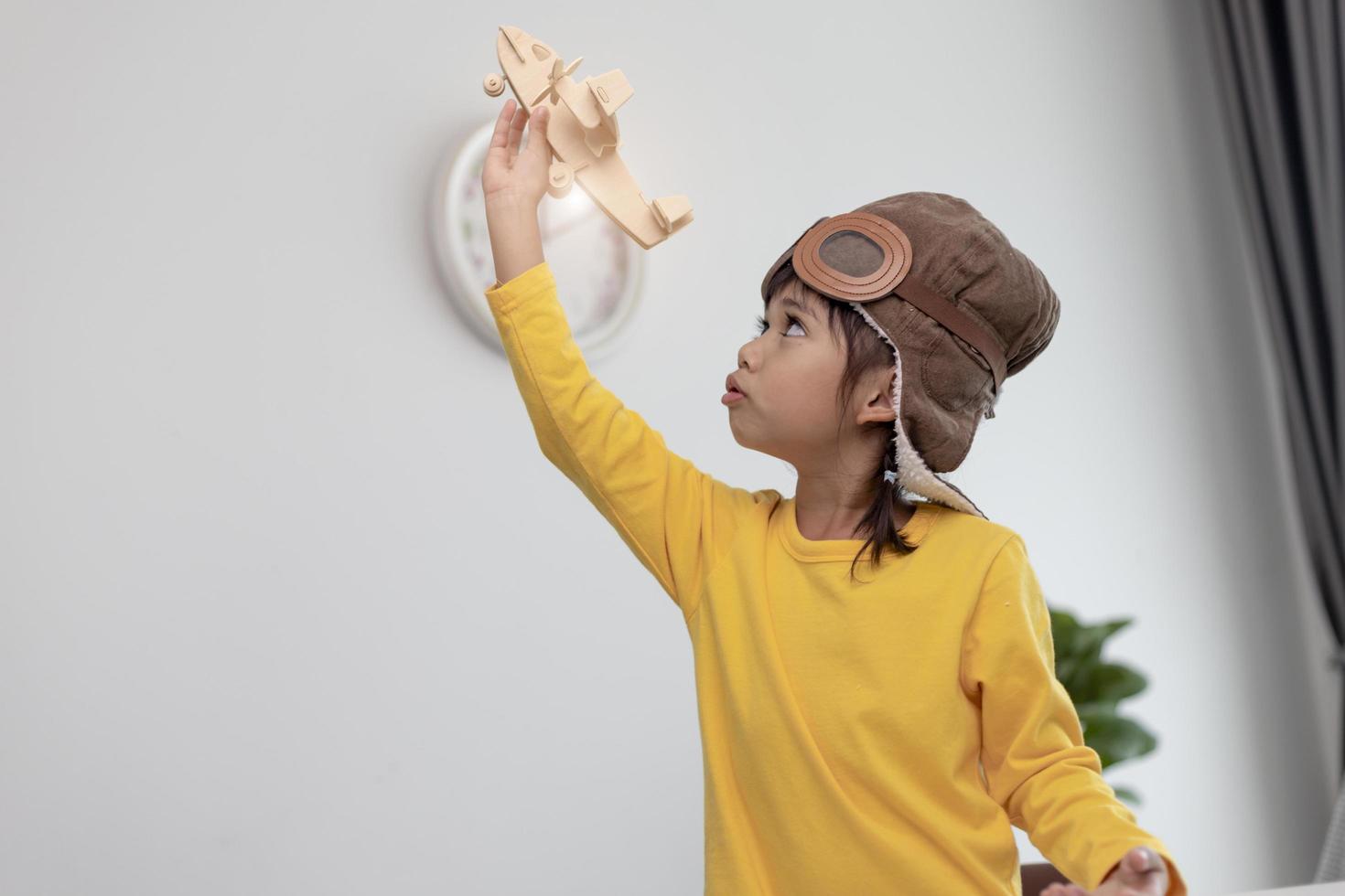 happy little girls play in airplanes indoors photo