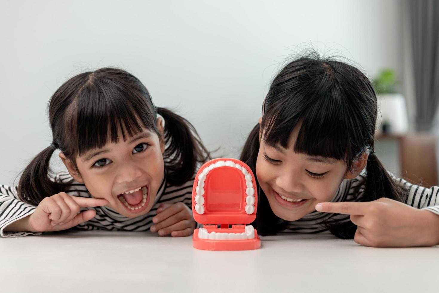 little girl smiling with a happy and cool smile on face. showing teeth. photo