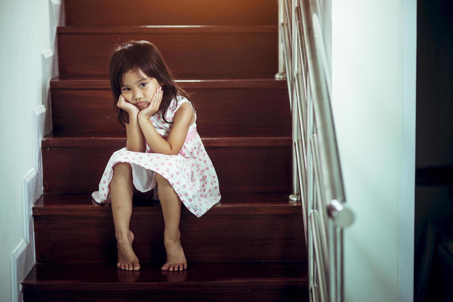 Sad child from this father and mother arguing, family negative concept.vintage color photo