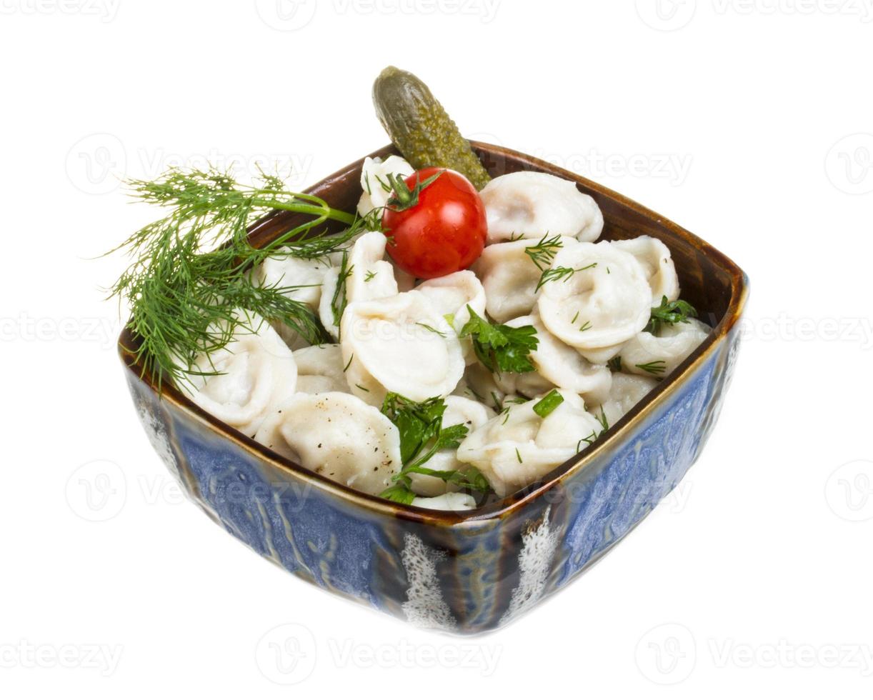 Bowl with traditional russian dish - pelmeni photo