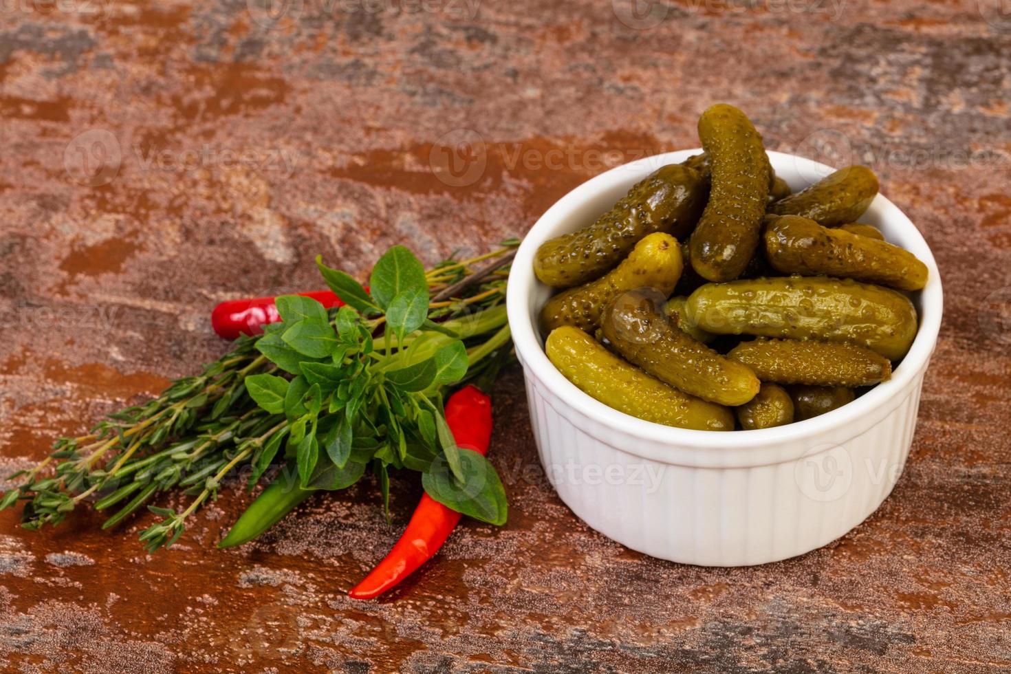 Pickled small cucumbers photo