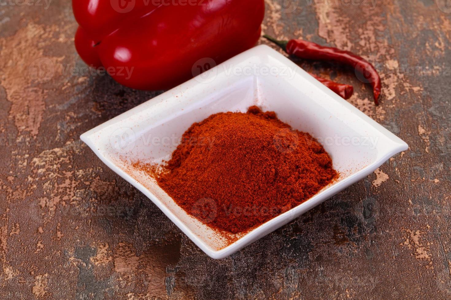 Paprika powder in the bowl photo