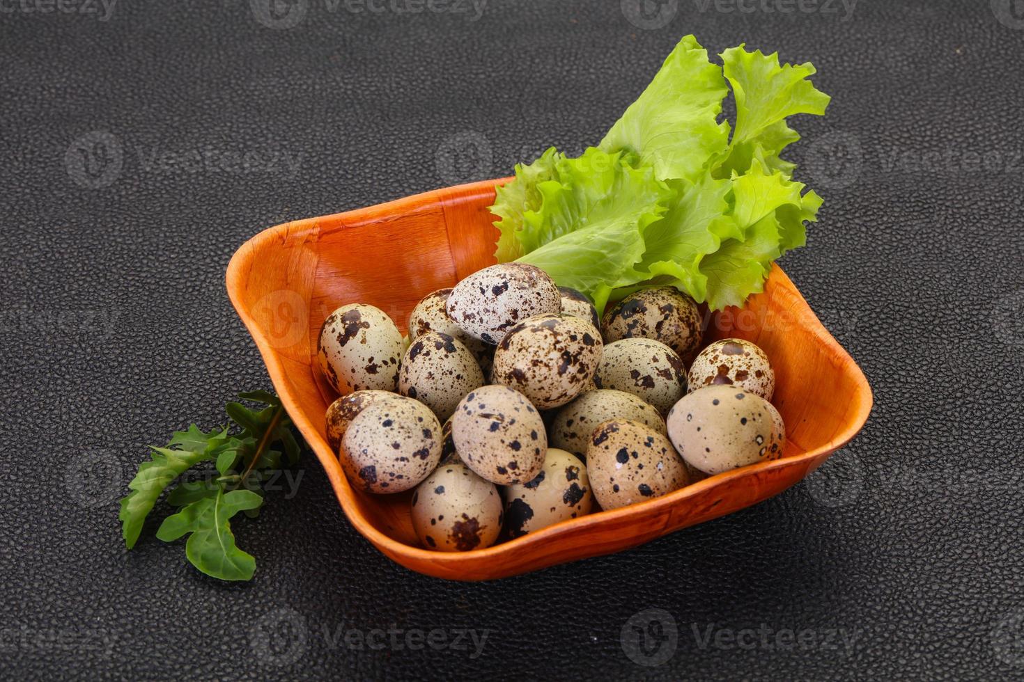 Quail eggs in the basket photo