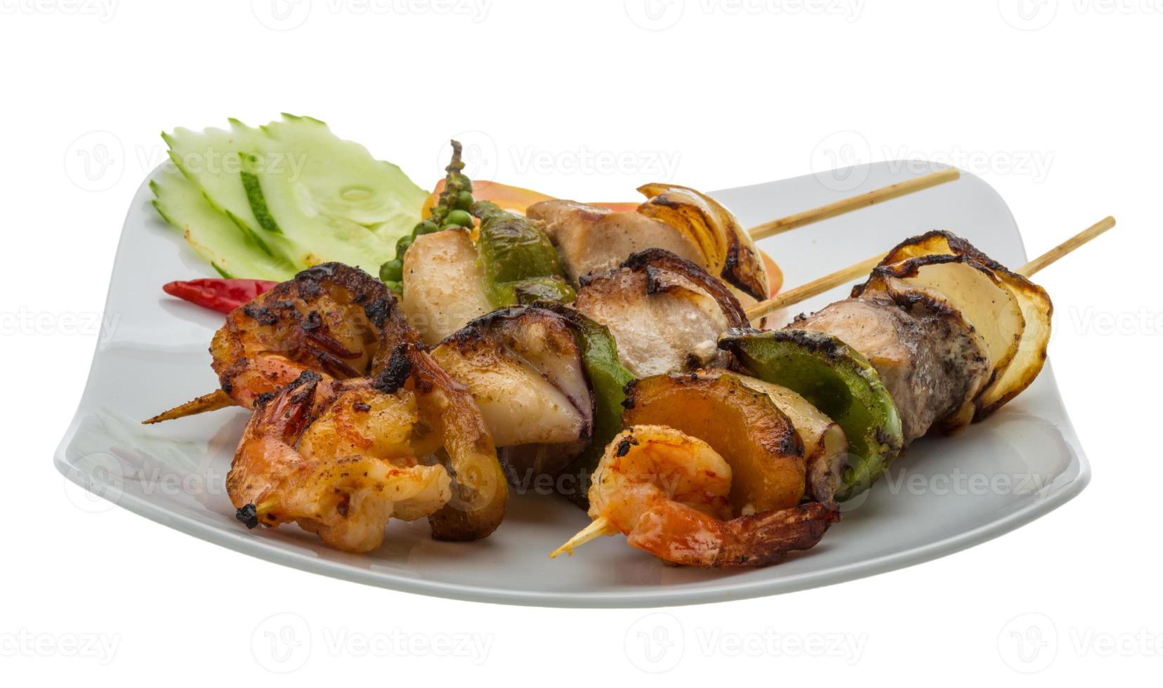 Seafood barbeque on white photo