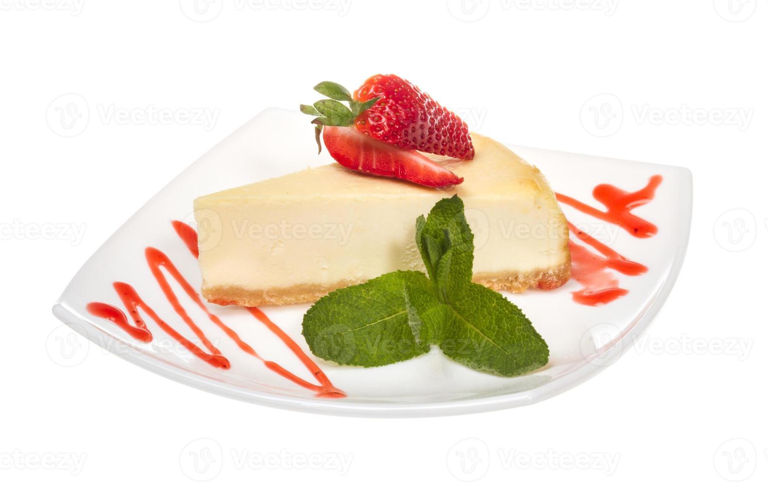 a piece of strawberry cheesecake on whit photo