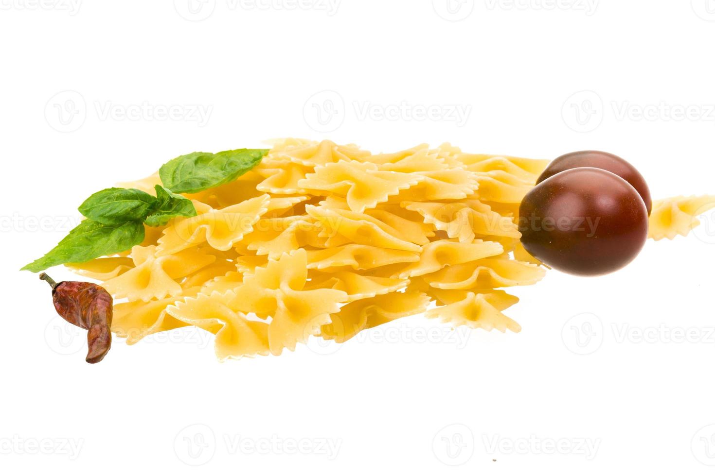 Raw macaroni on white photo