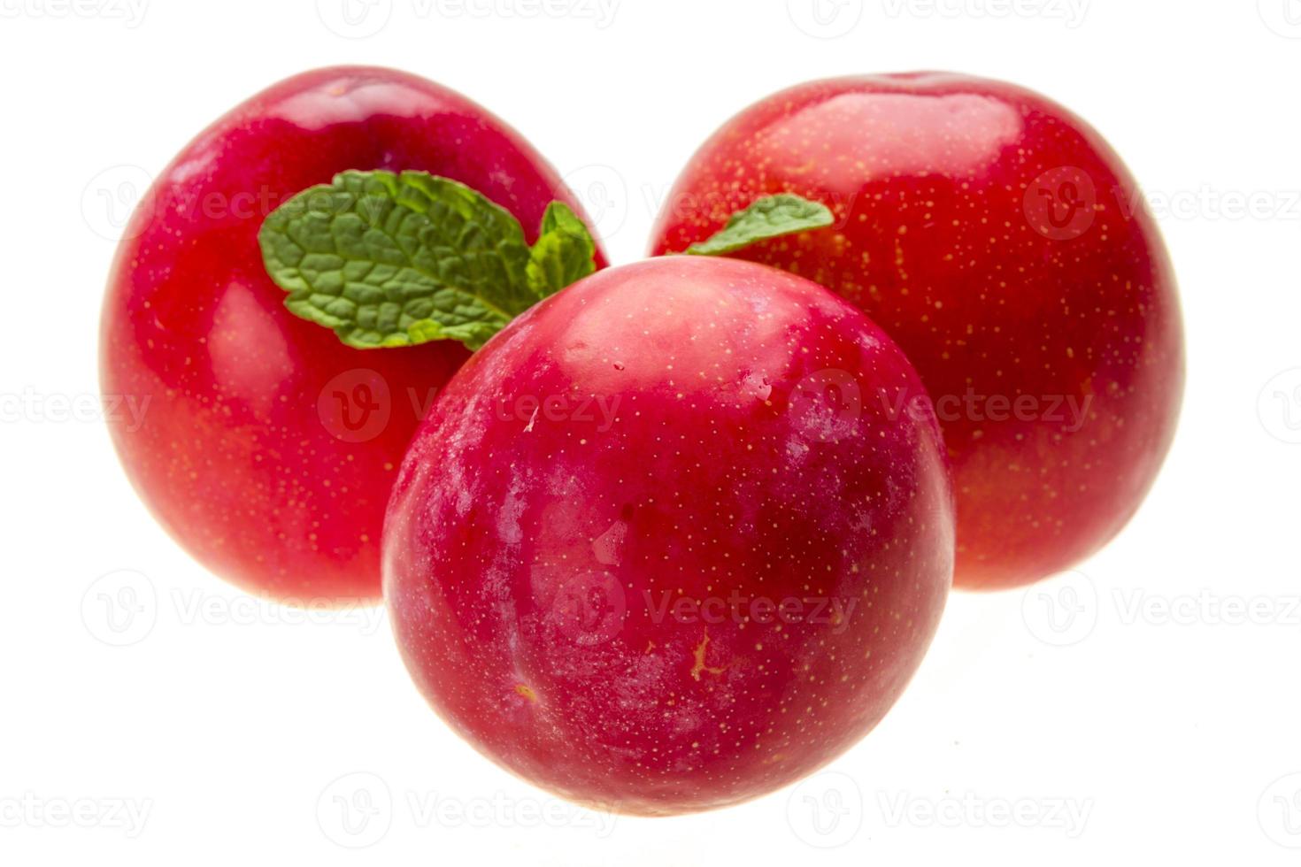 Bright ripe plum with mint photo