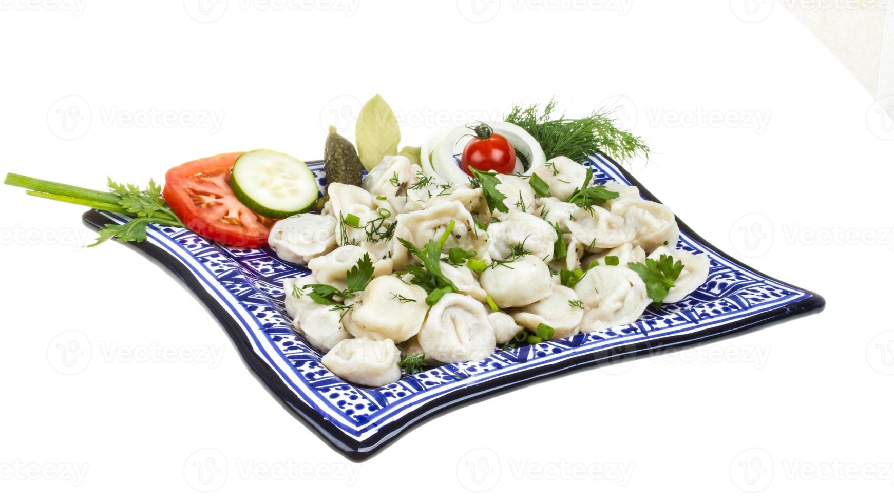 Bowl with traditional russian dish - pelmeni photo