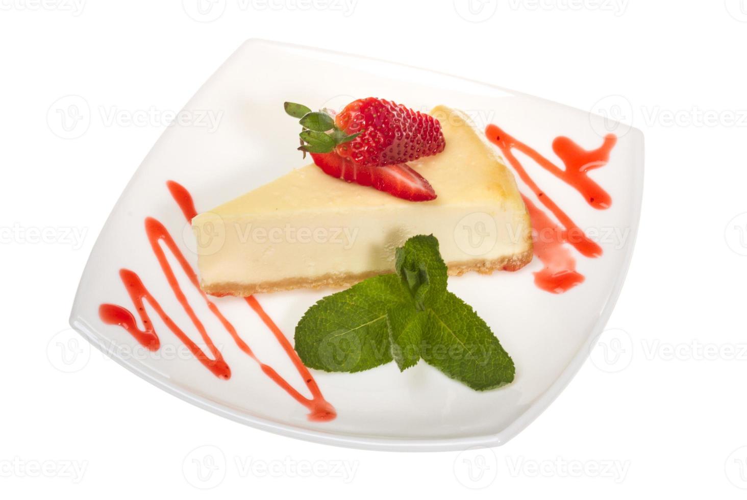 a piece of strawberry cheesecake on whit photo