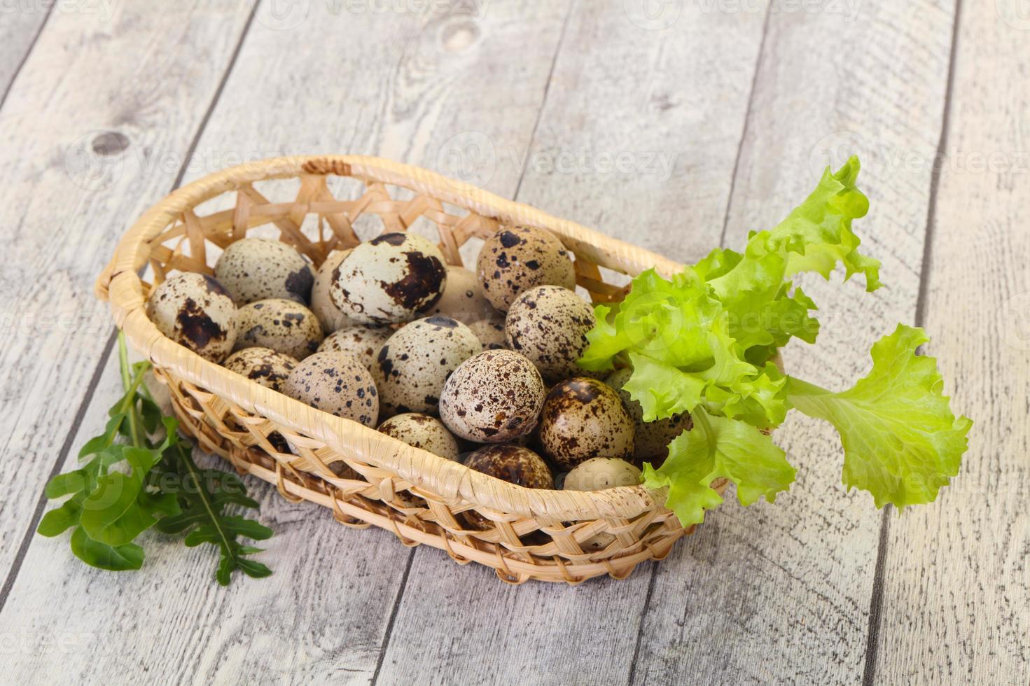 Quail eggs in the basket photo