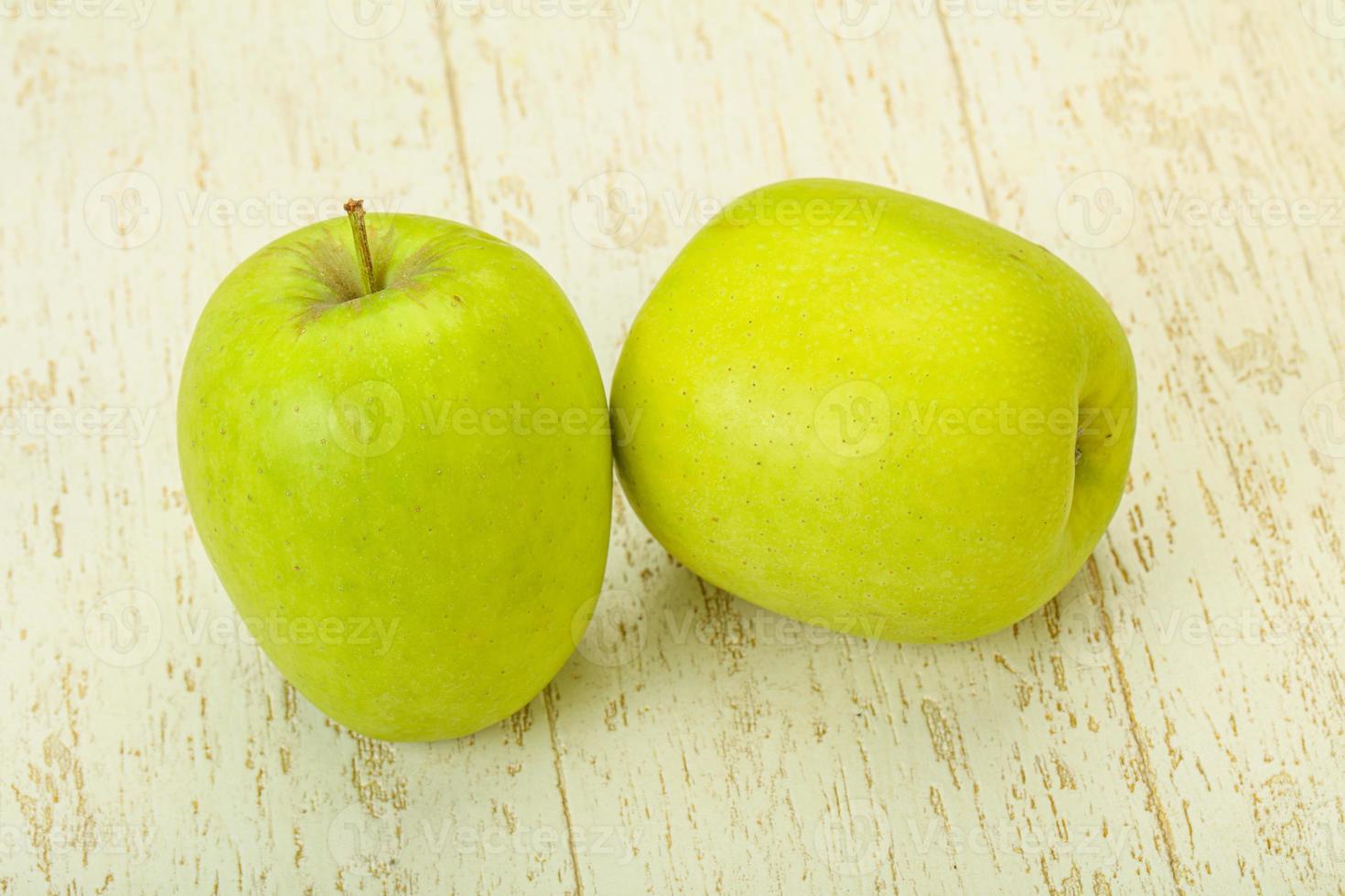 Two ripe green sweet apples photo