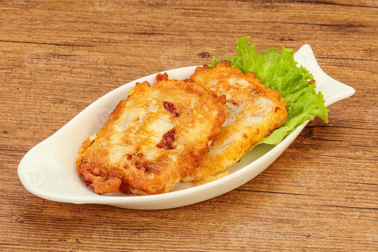 Roasted cod fish in bread photo