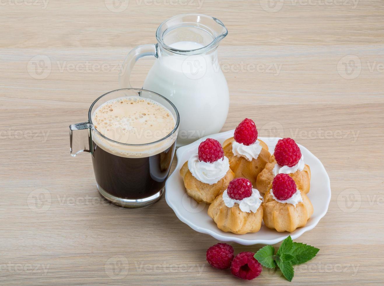 Profiterole with raspberry photo
