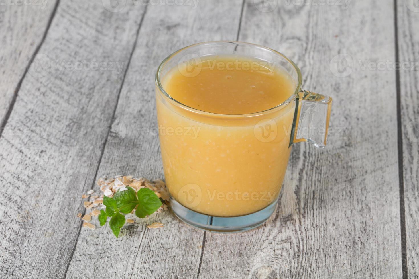 Dietary vegetarian oats milk over wooden photo