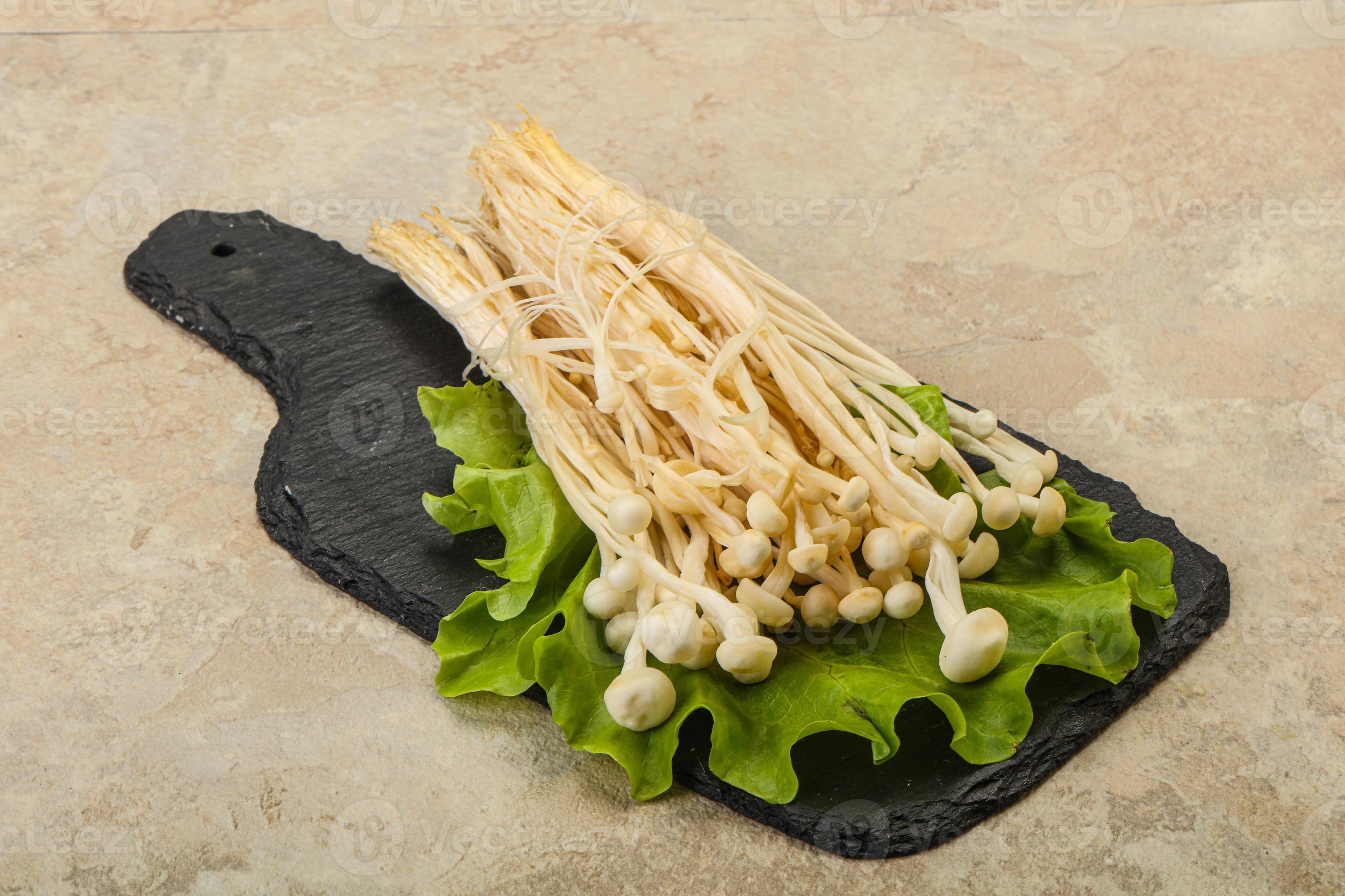 Raw Enoki mushrooms for cooking 8435255 Stock Photo at Vecteezy