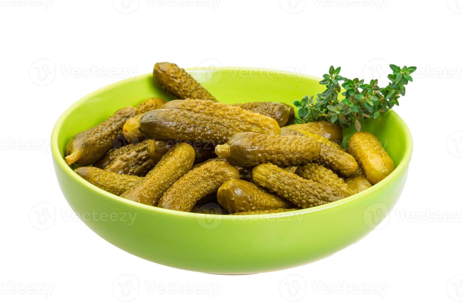 Marinated cucumbers, pickles in a bowl photo