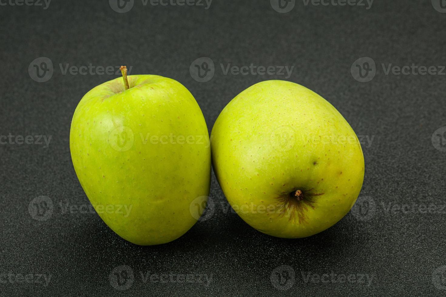 Two ripe green sweet apples photo