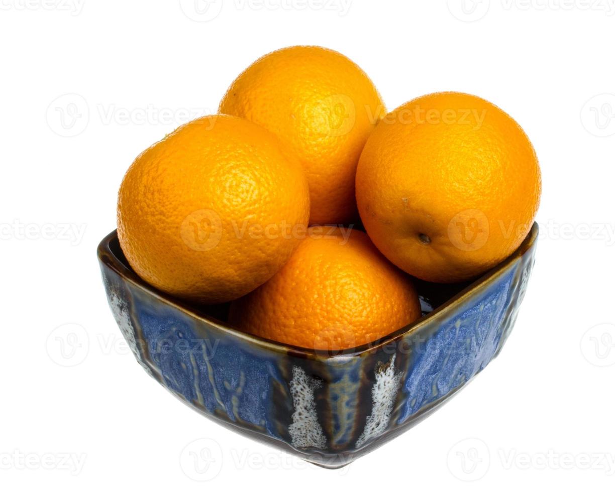 Heap of oranges in the dish photo