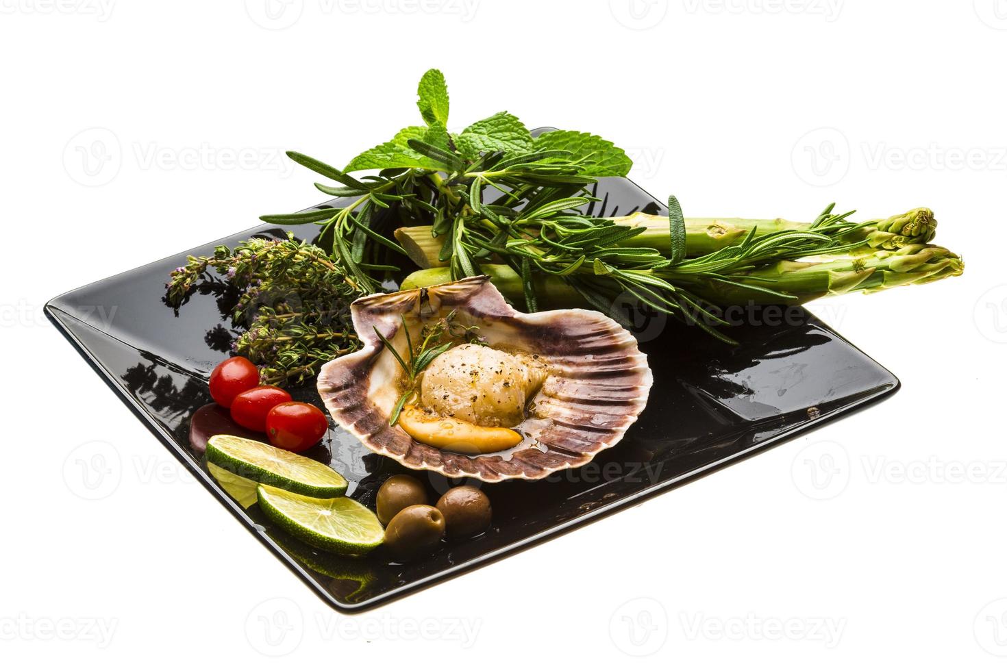 Scallop with asparagus, lime, mint and rosemary photo