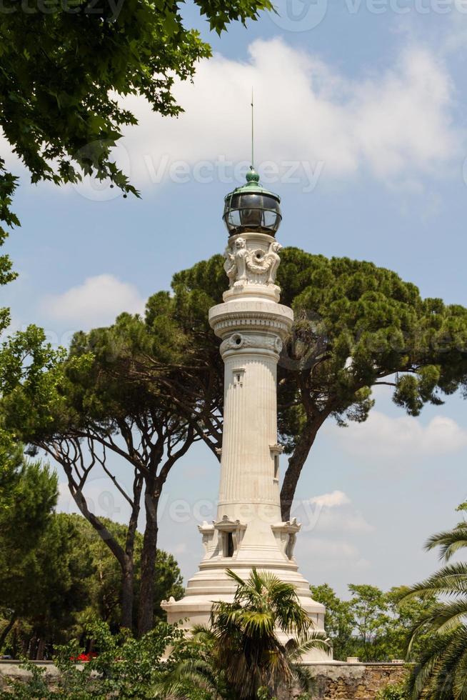 small lighthouse between the trees in Rome, Italy photo