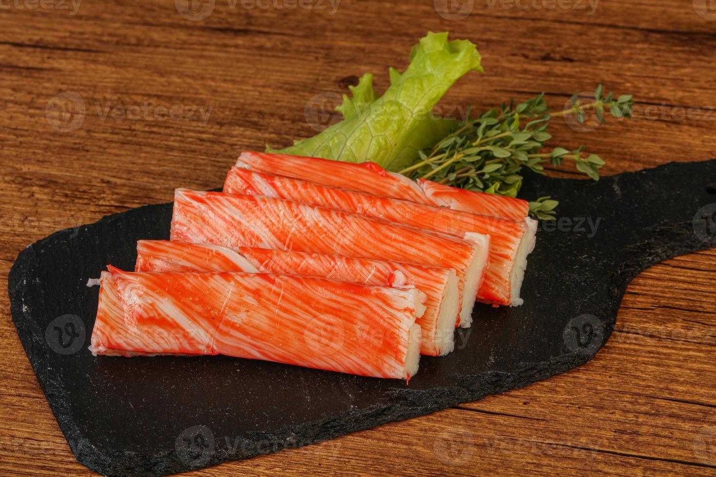 Crab sticks served salad leaves photo