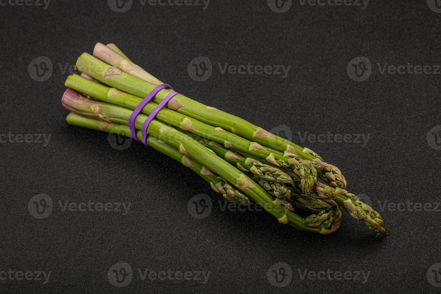 Vegan cuisine - Raw asparagus heap photo