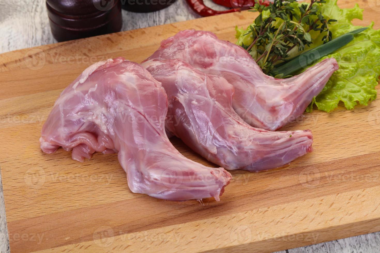 Raw rabbit legs photo