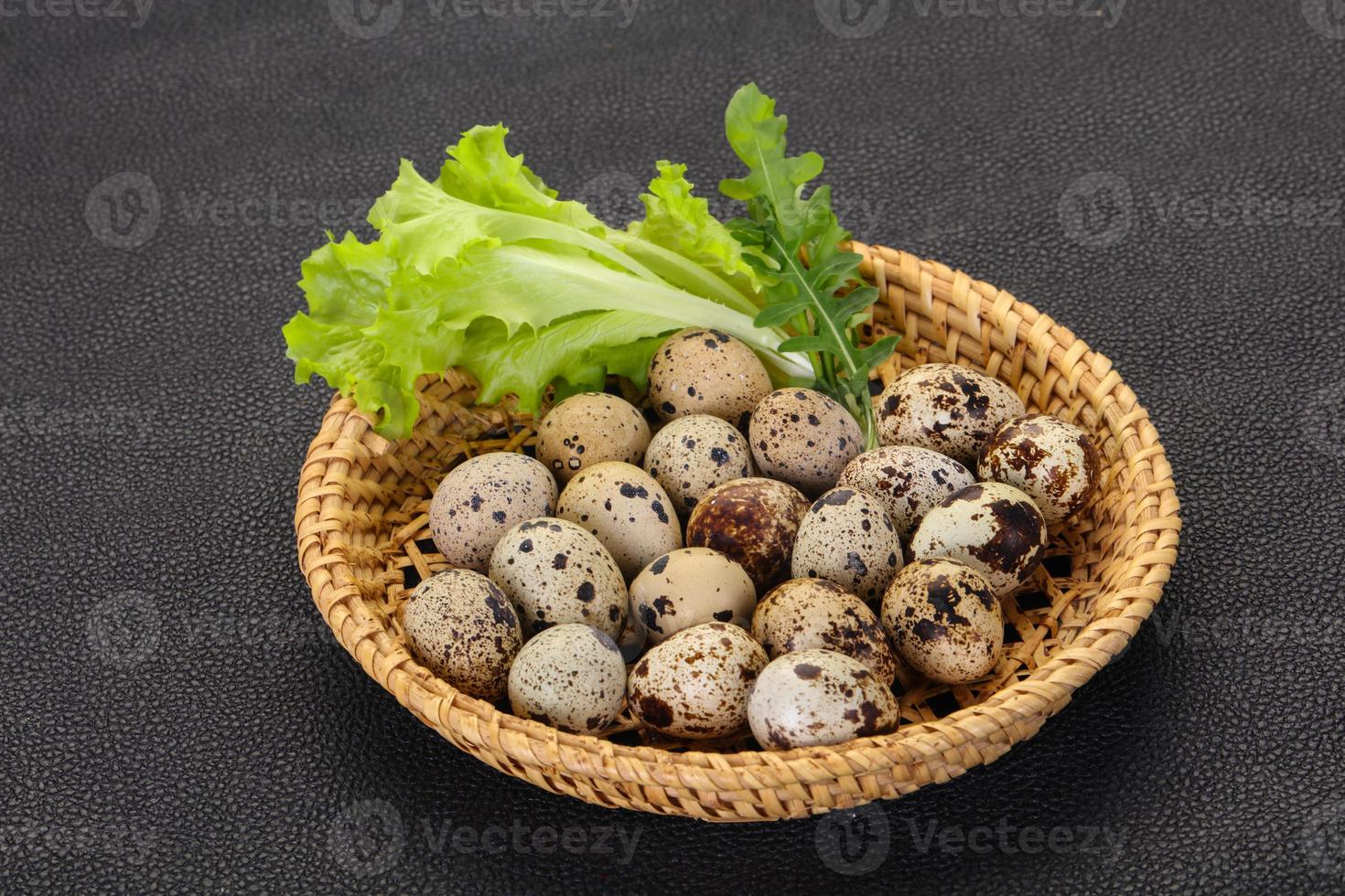 Quail eggs in the basket photo