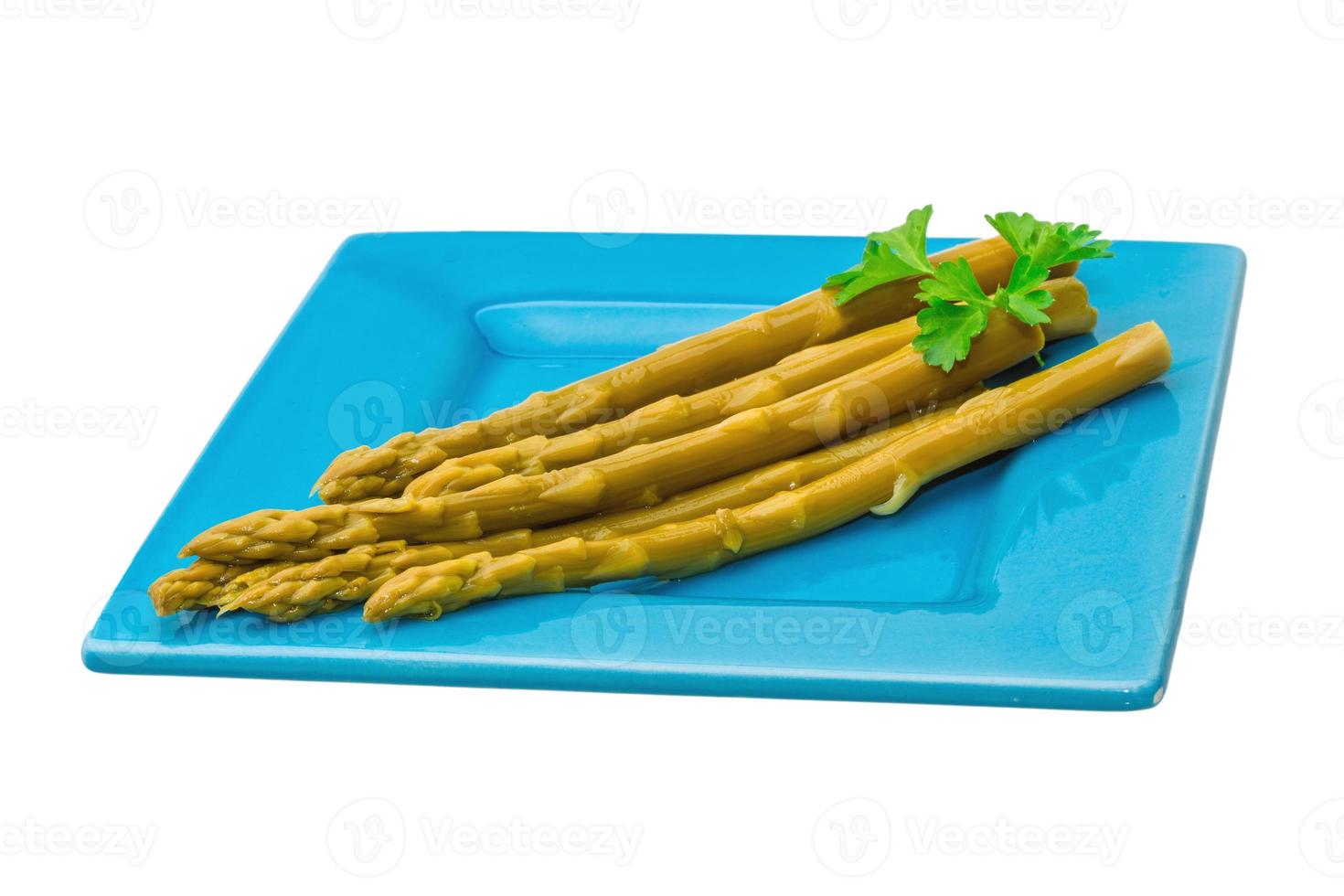 Boiled asparagus on white photo