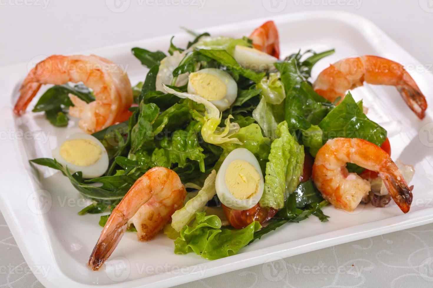 Salad with prawn, rocket and eggs photo