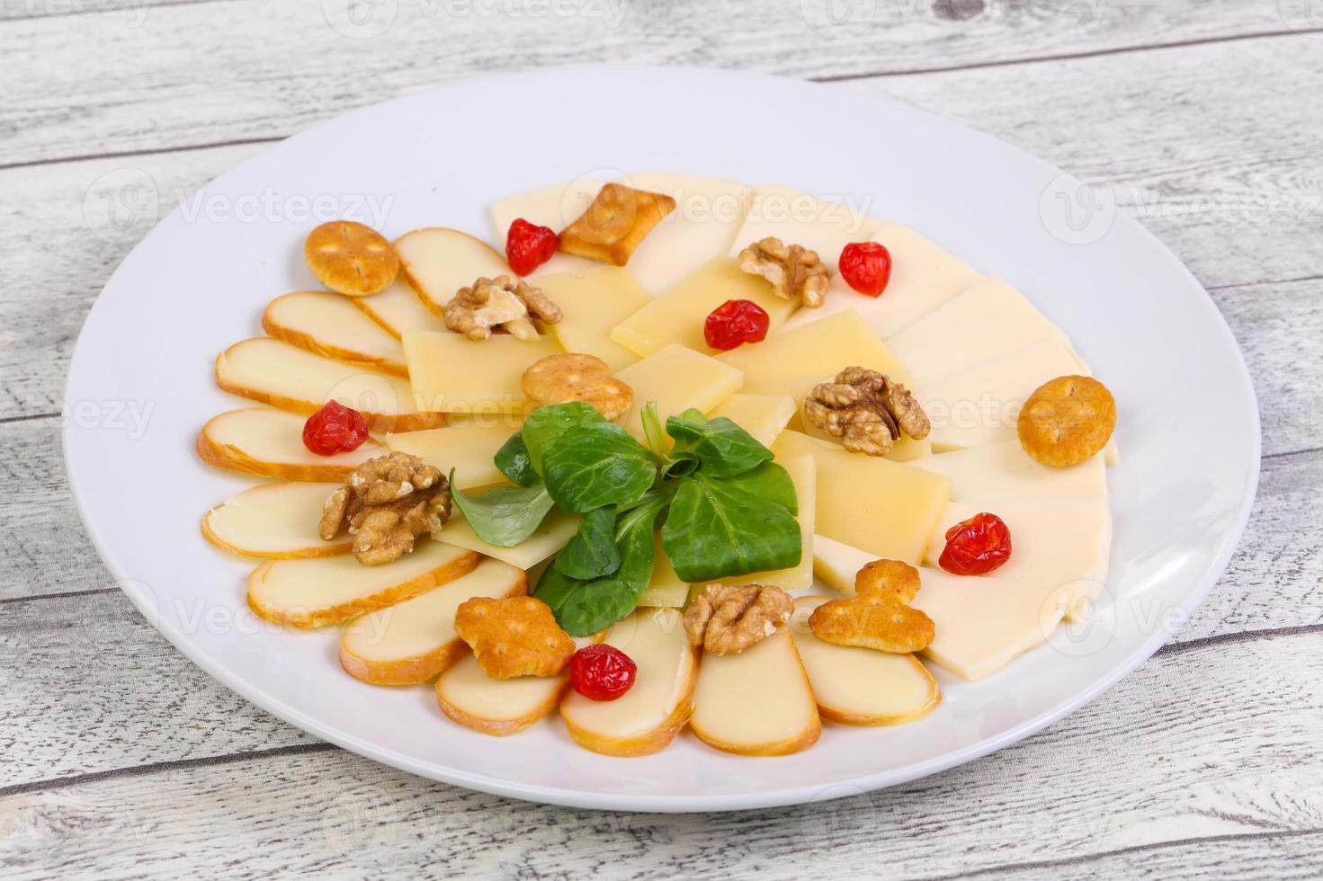 Cheese plate with nuts photo