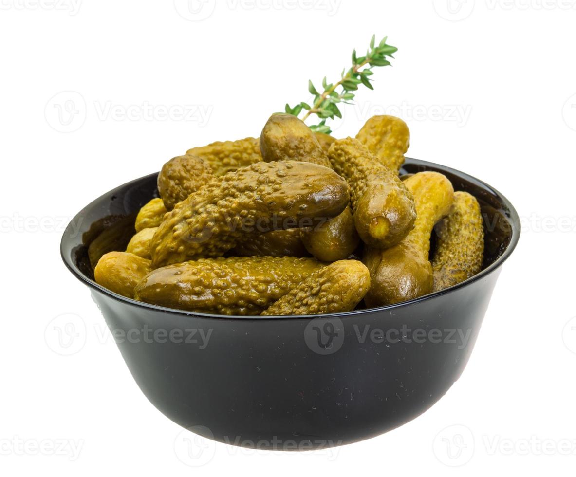 Marinated cucumbers, pickles in a bowl photo