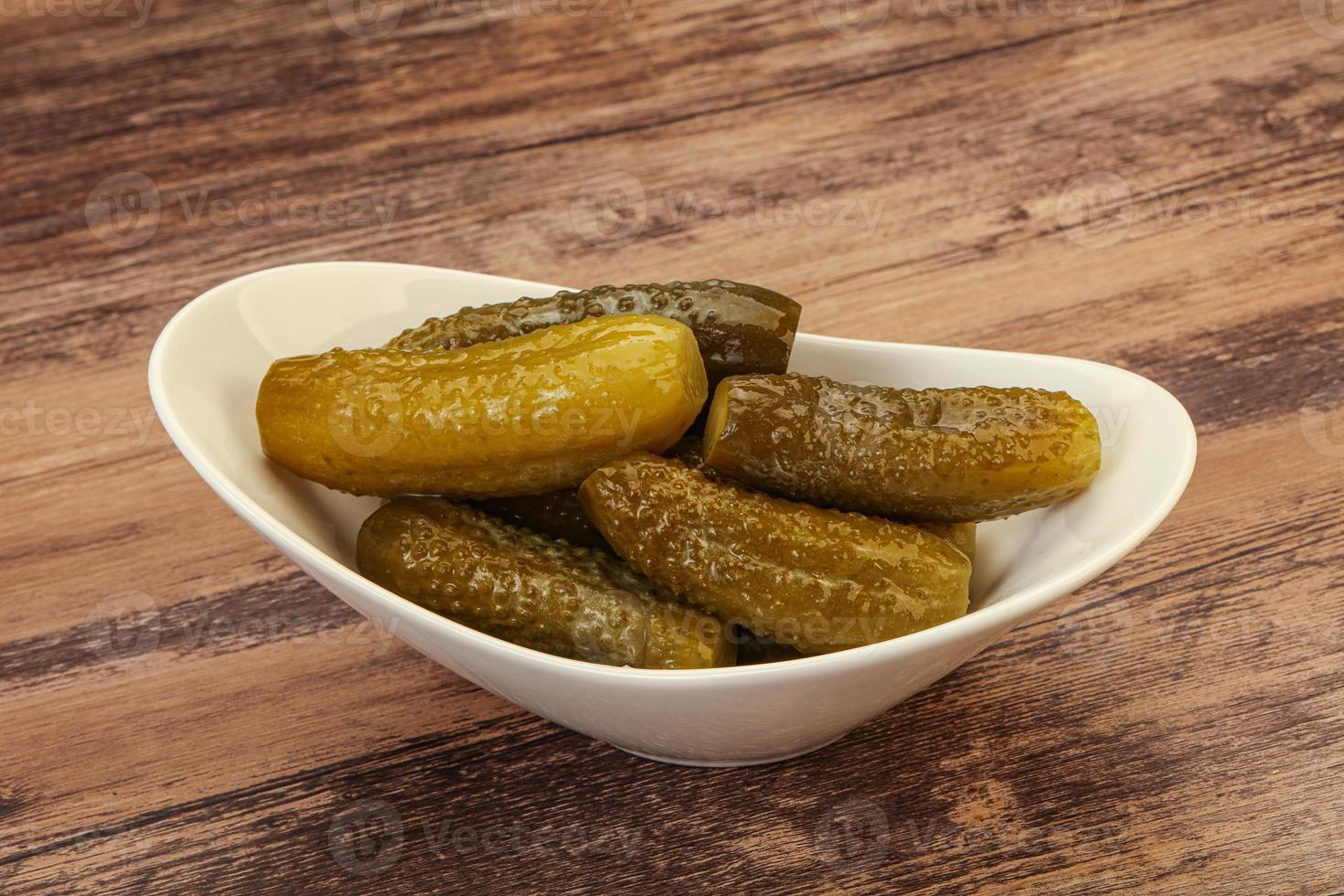 Pickled cucumbers in the plate photo