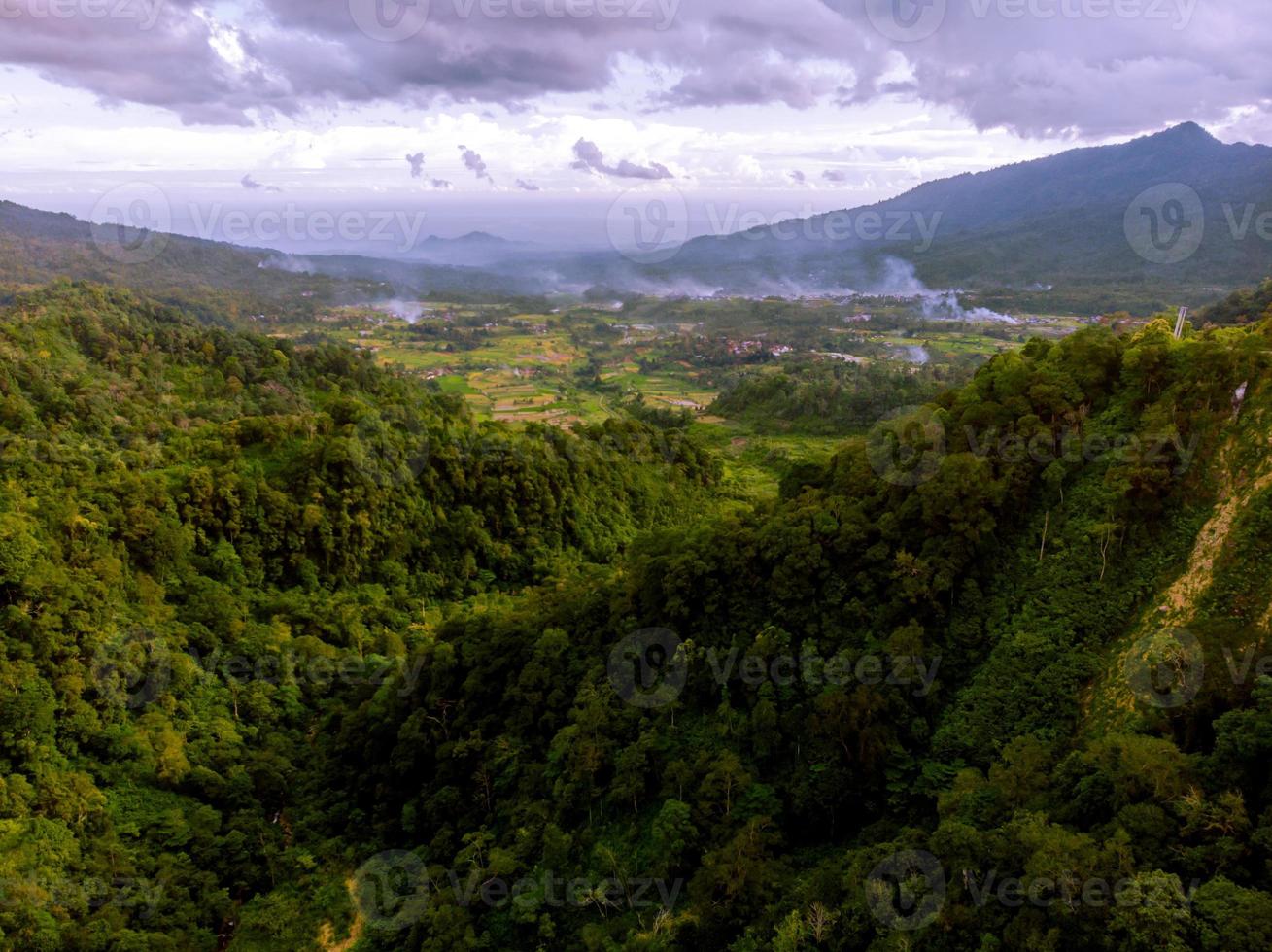 Panorama of mountain valley with cloudy sky photo