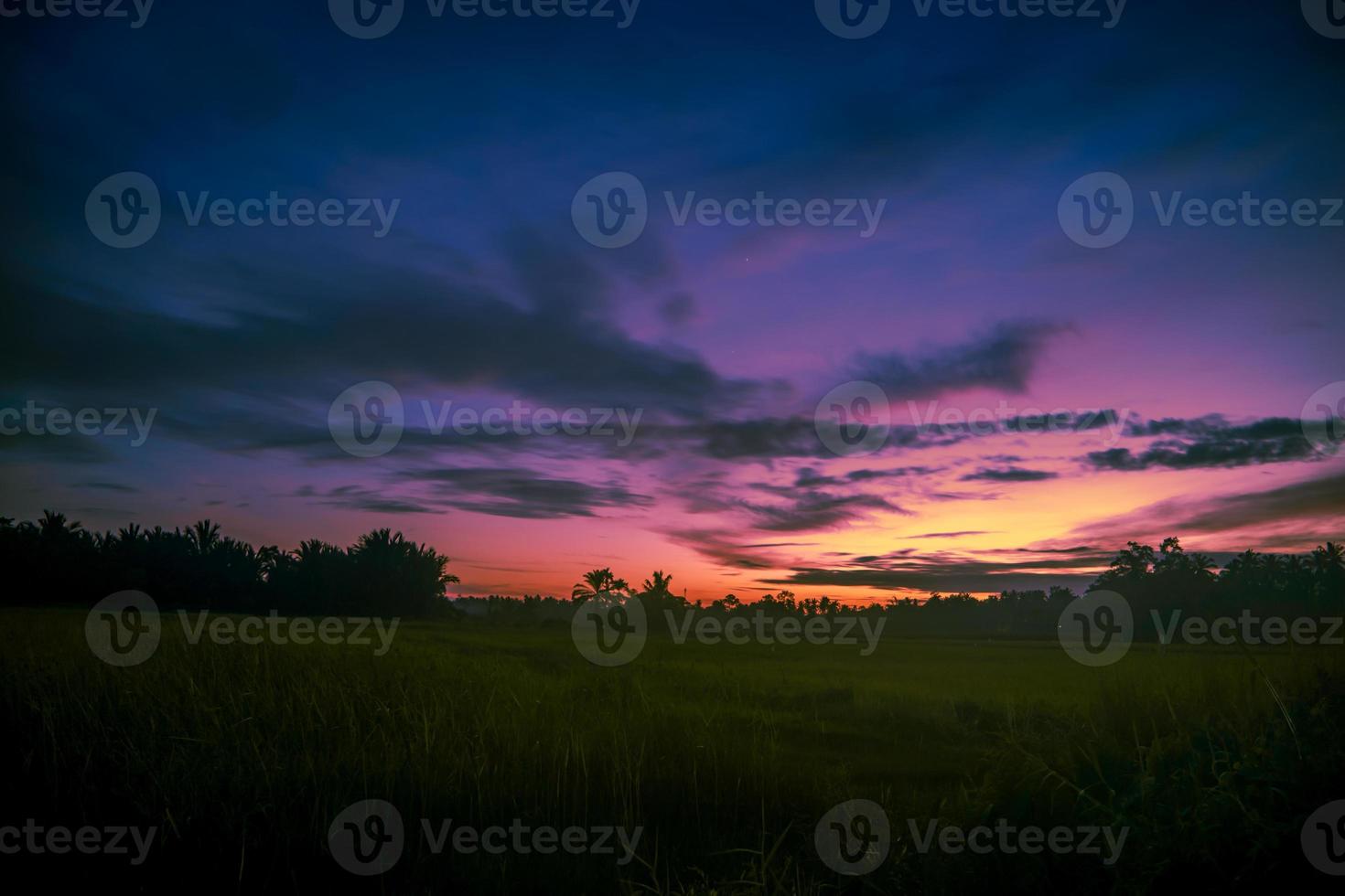 Evening sky in meadow with clouds photo