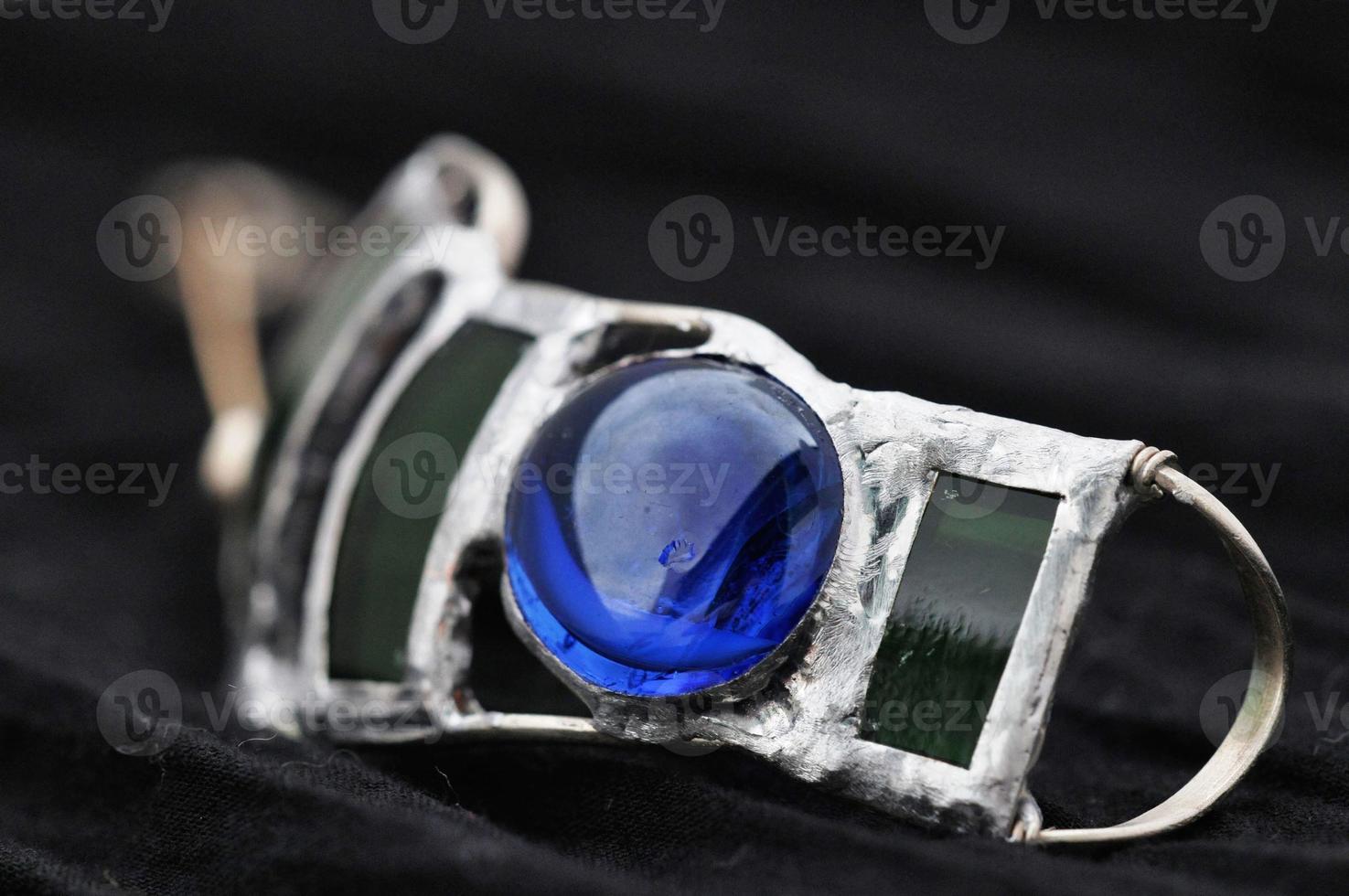 Handmade blue jewel photo