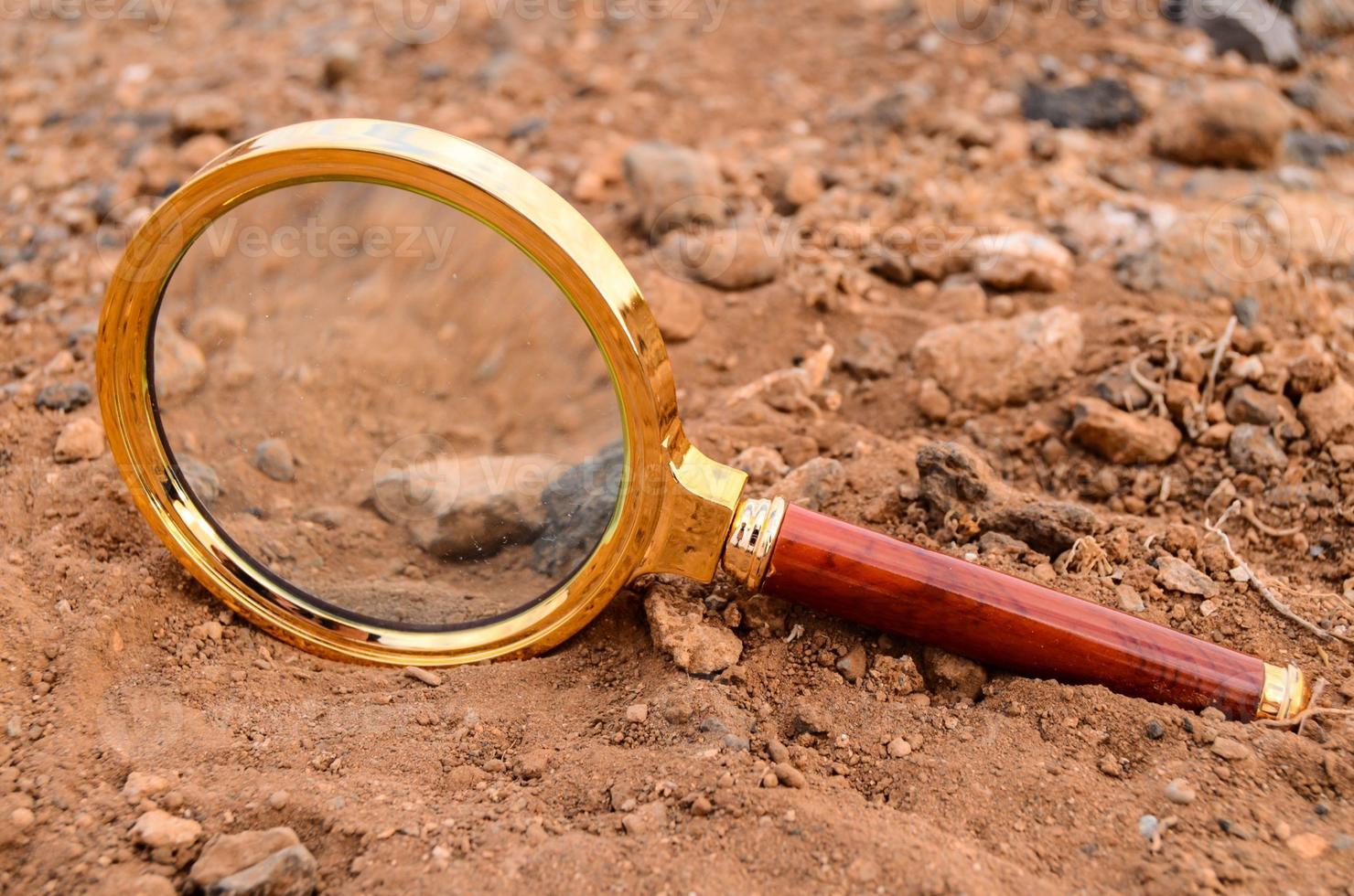 Magnifying Glass Abandoned On The Desert photo