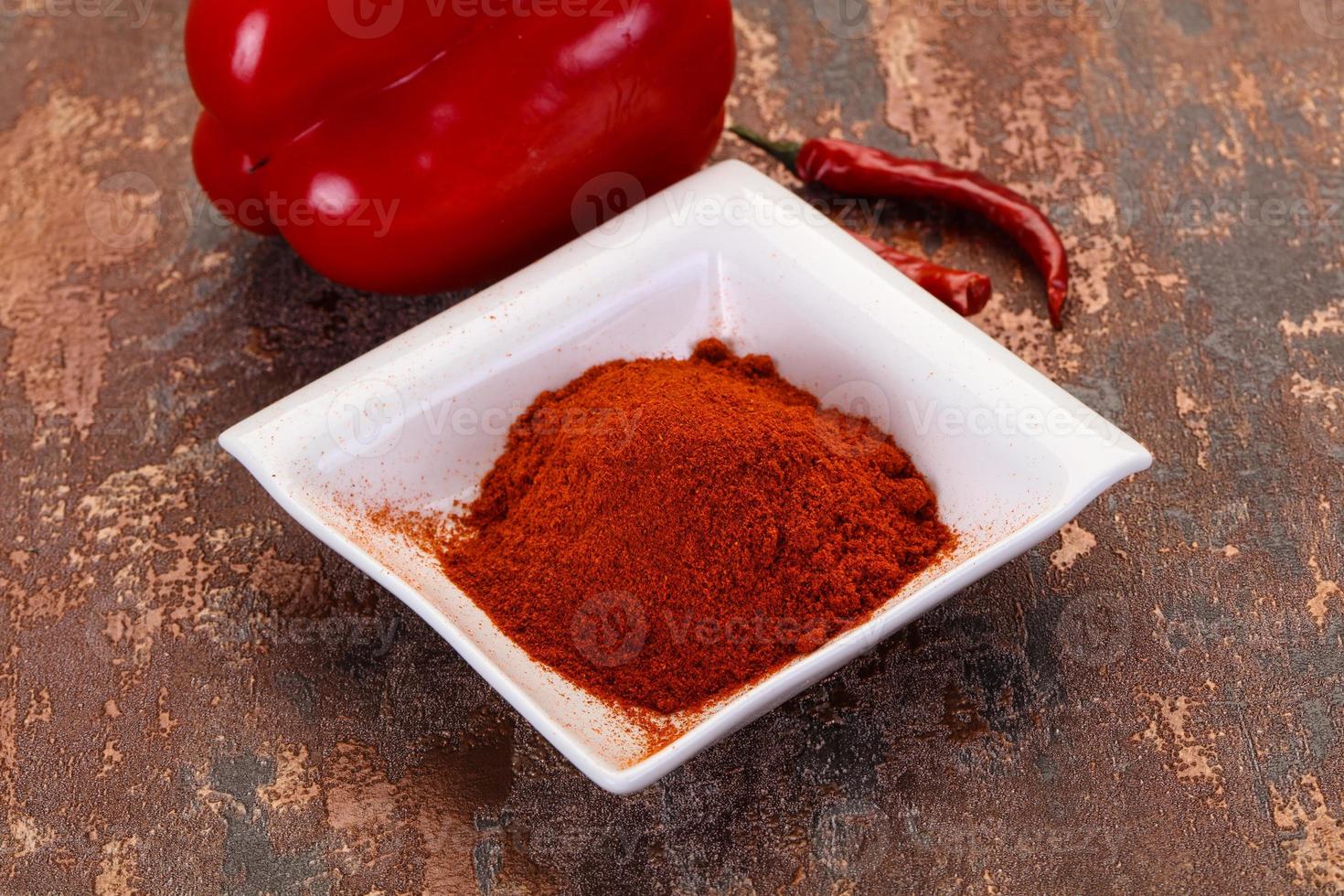 Paprika powder in the bowl photo